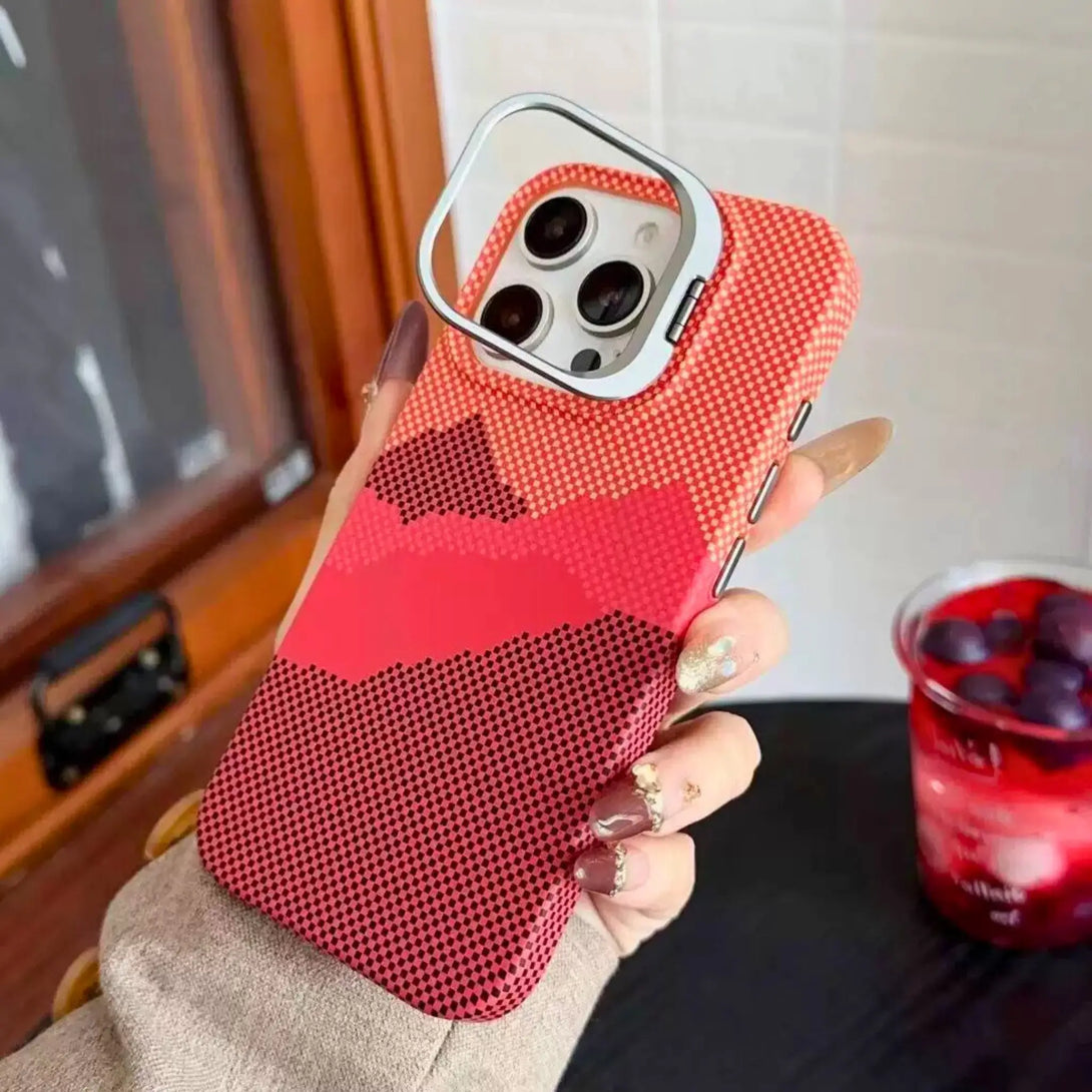 Red textured iPhone case held by a hand with a raised camera bumper