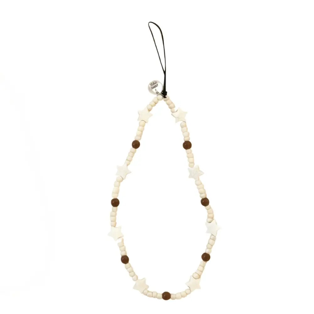 Full view of Off White beaded phone wrist strap with star beads and brown accents.
