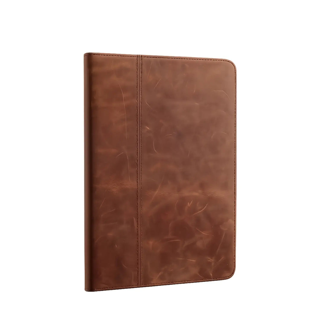 Vintage leather iPad case in yellow brown standing upright, showing the distressed grain and stitched center spine.